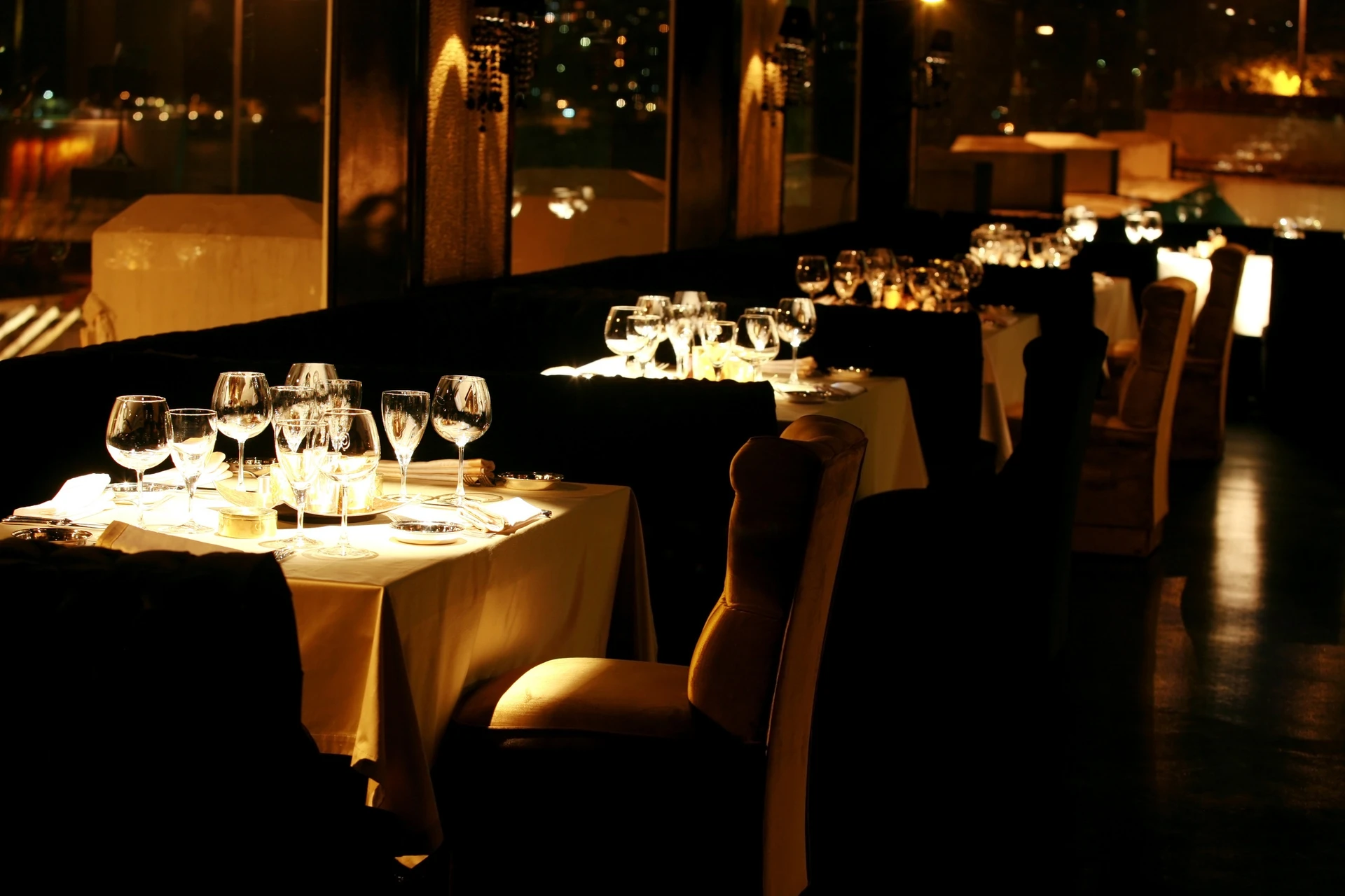 Set tables in a warmly lit dining room
